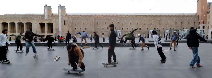 Collage of skateboarders doing tricks in the plaza